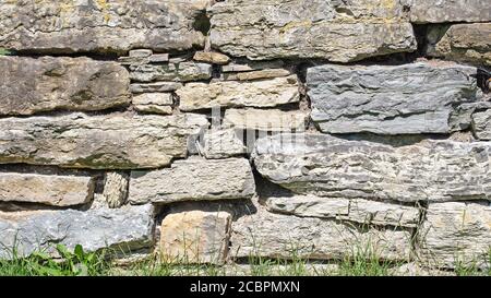 Muro di pietra naturale in primo piano Foto Stock