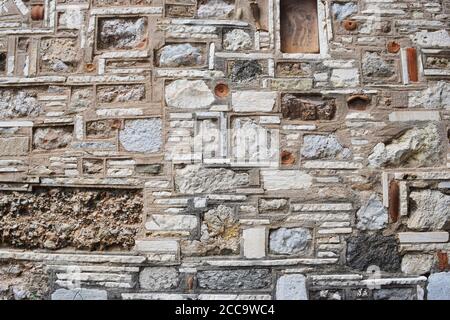 Vecchio greco pietra muro dettaglio Foto Stock