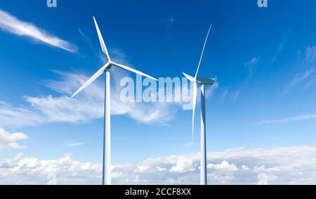 Due turbine eoliche contro un cielo blu Foto Stock