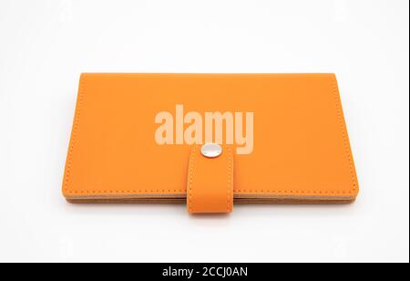 Notebook arancione isolato su sfondo bianco Foto Stock