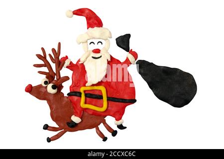 Divertimento Cartoon Santa cavalca un cervo con la sua borsa. Opere d'arte per bambini. Foto Stock