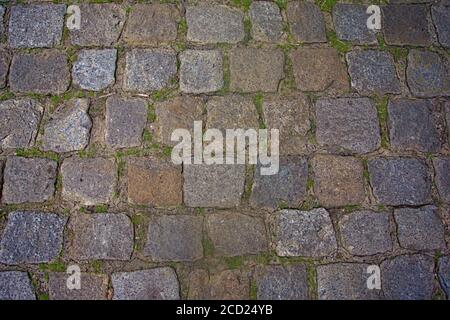 Una sezione di strada acciottolata Foto Stock