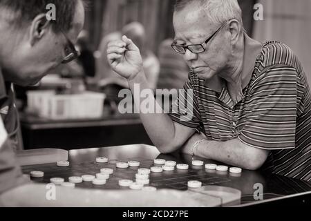 Xiangqi suonato a Singapore Foto Stock