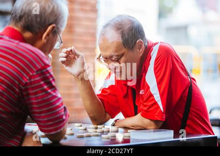 Xiangqi suonato a Singapore Foto Stock