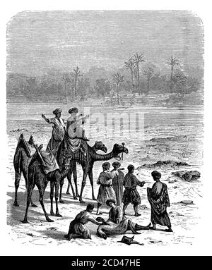 La carovana di persone che attraversano il deserto osserva un miraggio fata morgana, fenomeno ottico che distorce oggetti lontani; si verifica quando raggi di luce piegati che attraversano strati d'aria di temperature diverse Foto Stock