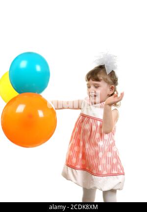 Ragazza piccola felice con palloncini Foto Stock