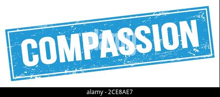 Testo COMPASSIONE sul segno di timbro rettangolare blu. Foto Stock
