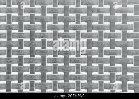 Tessuto in tessuto di vimini in plastica, motivo sfondo grigio con intemperie Foto Stock