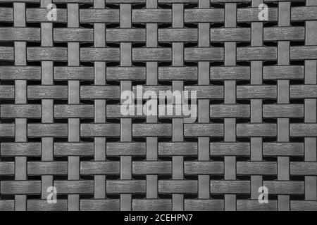 Tessuto di vimini in plastica grigia, motivo sfondo marrone con intemperie Foto Stock