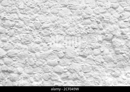 Bianco bella struttura naturale di una pietra rivestita di argilla in vernice. Il muro di un antico edificio storico. Luogo per il testo sul facad della città fatto a mano Foto Stock
