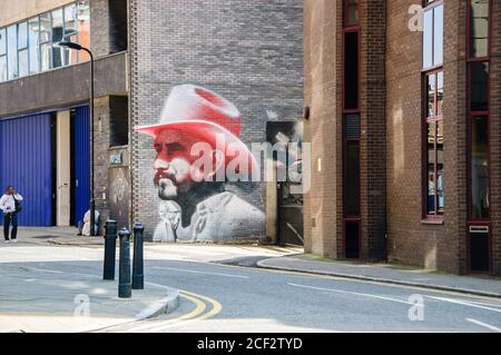 LONDRA, INGHILTERRA, Regno Unito - 4 MAGGIO 2014: Graffiti Cowboy sul muro di Hewlett Street (creato da El Mac). L'arte urbana nell'area di Shoreditch attrae i touris Foto Stock