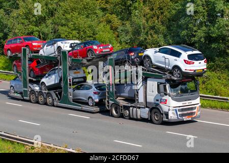 BCA Automotive Auto Transporter, 2016 Volvo FM trasporto di seconda mano; Automobile pesante trasporto merci pesanti camion consegna, trasporto, camion, trasporto, raccolta e consegne, multi-car veicolo commerciale, camion, carico speciale, veicolo, consegna, trasporto, industria, trasporto sull'autostrada M6. Foto Stock