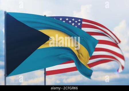 Sventolando bandiera americana e bandiera delle Bahamas. Vista in primo piano, illustrazione 3D. Foto Stock