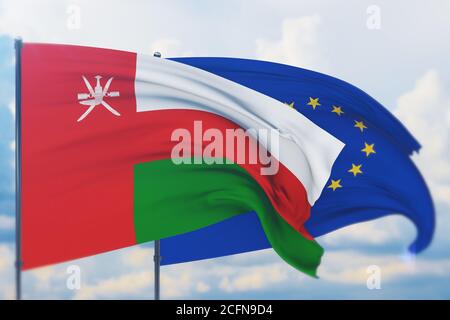 Sventolare la bandiera dell'Unione europea e la bandiera dell'Oman. Vista in primo piano, illustrazione 3D. Foto Stock