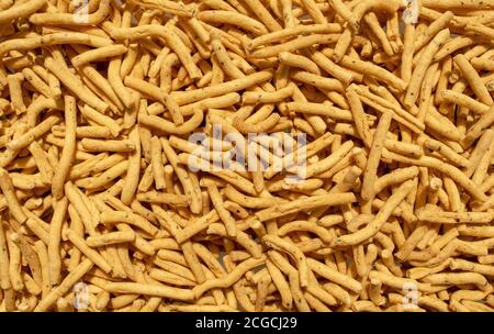 Sfondo Ratlami Sev. Popolare spuntino Gujarati. Ratlami Masala Sev. Vista dall'alto. Spuntino indiano di strada. Foto Stock