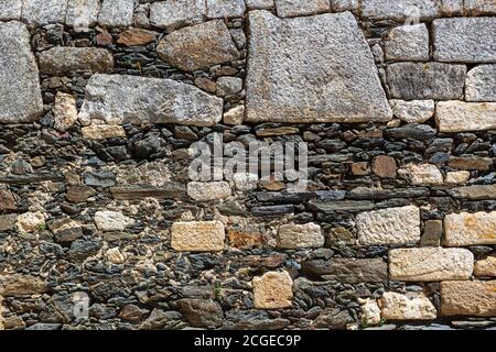 Strutture architettoniche, dettagli arrugginiti e rustici scist muratura... Foto Stock