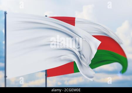 Bandiera bianca sul flagpole che sventola nel vento e bandiera di Oman. Vista in primo piano, illustrazione 3D. Foto Stock