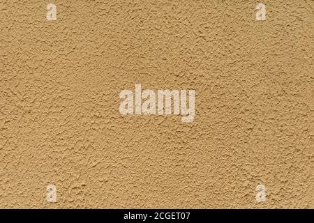 Struttura a stucco con struttura grossolana. Colore beige. Foto Stock