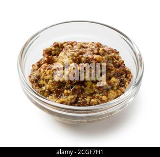 Salsa di senape in un recipiente di vetro contro un bianco sfondo Foto Stock