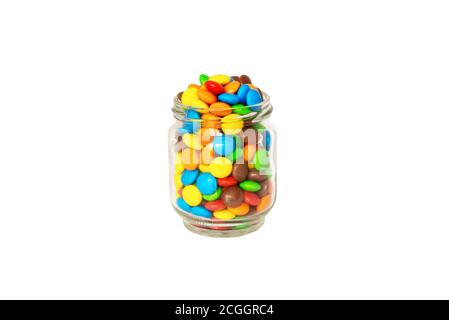 Caramelle multicolore in un vaso di vetro isolato su un bianco sfondo Foto Stock