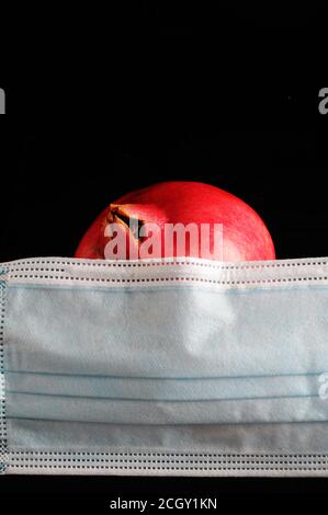 Corona Rosh hashana - concetto - maschera con melograno Foto Stock
