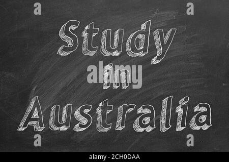 Disegno a mano 'Stody in Australia' su lavagna nera Foto Stock