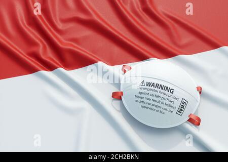 Maschera chirurgica medica coronavirus sulla bandiera nazionale indonesiana. Malattia, pandemia, virus covid-19 in Indonesia, concept 3d rendering Illustrat Foto Stock