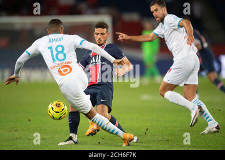 Parigi, Francia. 13 Settembre 2020. Alessandro Florenzi (C) di Parigi Saint-Germain passa la palla durante la Ligue 1 match tra Paris Saint Germain e Olympique de Marseille al Parc des Princes di Parigi, Francia, 13 settembre 2020. Credit: Jack Chan/Xinhua/Alamy Live News Foto Stock