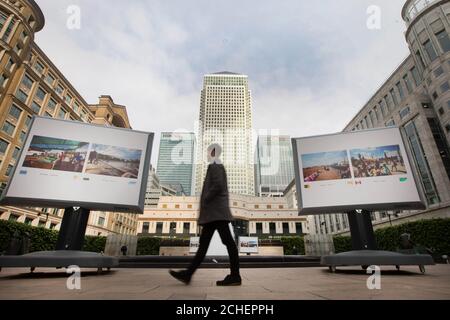 USO EDITORIALE SOLO i membri del pubblico guardano le immagini delle capitali di tutto il mondo dal fotografo Jeroen Swolfs al debutto britannico della mostra fotografica Streets of the World a Canary Wharf, Londra. Foto Stock