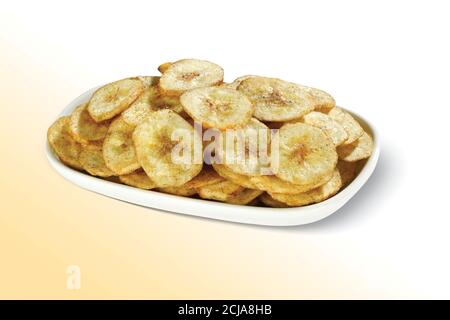 Cialde fritte, chip o wafer Kela o Banana sani, disidratati, cucina Kerala fritta in olio, fette di Banana trasformandosi in chip Foto Stock