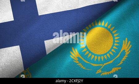 Finlandia e Kazakhstan due bandiere tessuto, tessuto Foto Stock