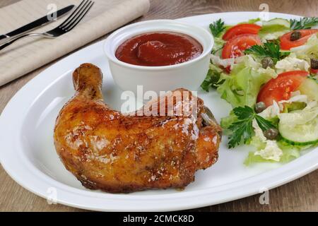 Cosce di pollo al forno Foto Stock