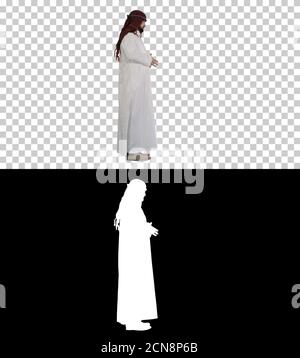 sheikh arabo con keffiyeh in piedi, canale Alfa con Silhou Foto Stock