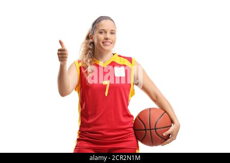 Ragazza giocatore di basket in posa con una palla e mostrando pollici isolato su sfondo bianco Foto Stock