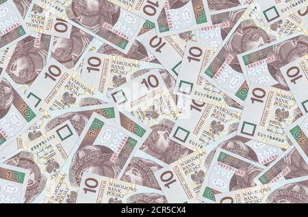 10 polacchi zloty fatture si trova in grande mucchio. Ricco background concettuale di vita. Grande quantità di denaro Foto Stock