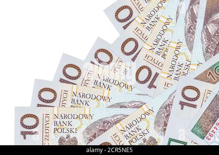 10 polacchi zloty fatture giace in ordine diverso isolato su bianco. Concetto di banca locale o di creazione di denaro. Banner di background aziendale Foto Stock