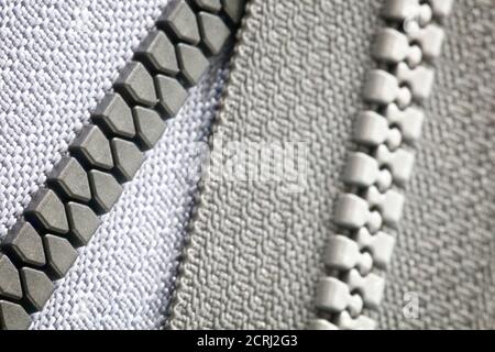 Texture di sfondo grigio zip in primo piano, concetto fai da te hobby Foto Stock