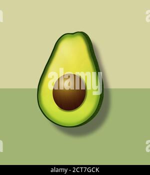 Un taglio di avocado a metà è visto su uno sfondo verde. Foto Stock