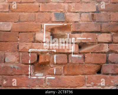 tre punti proiettili su un muro a jallianwala bagh ad amritsar, india Foto Stock