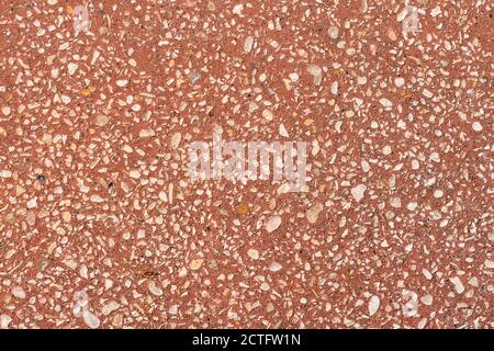 Sfondo a grana rossa per superfici architettoniche, piastrelle per pavimenti o panca per parchi Foto Stock