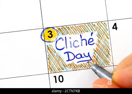 Dita donna con penna di scrittura promemoria Cliche giorno in calendario. 3 novembre. Foto Stock