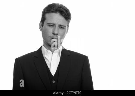 Ritratto di uomo d'affari stressato in vestito che guarda triste e stanco Foto Stock