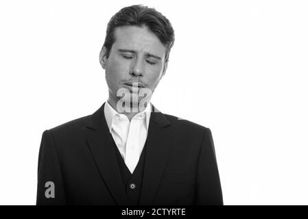 Ritratto di uomo d'affari stressato in vestito che guarda triste e stanco Foto Stock