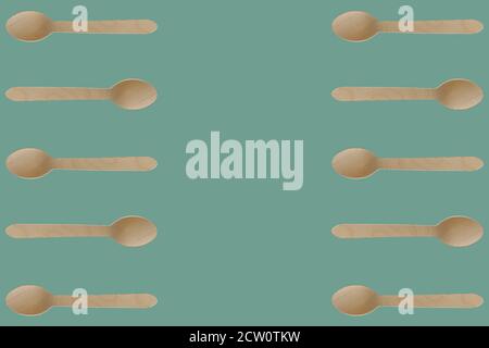 Struttura di utensili a cucchiaio in legno. Posate usa e getta prive di plastica, ecocompatibili. Ripetizione piatta e senza giunture con spazio di copia. Foto Stock