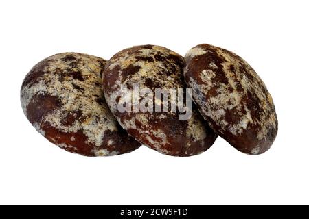 Tre deliziosi pan di zenzero al cioccolato isolato su uno sfondo bianco primo piano Foto Stock