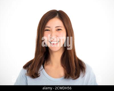 Primo piano ritratto di sorridente ragazza asiatica Foto Stock