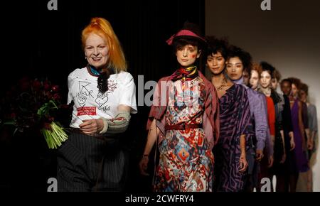Designer Vivienne Westwood (L) walks on the catwalk with her models after the presentation of her Vivienne Westwood Red Label 2012 Autumn/Winter collection during London Fashion Week February 19, 2012. REUTERS/Suzanne Plunkett (BRITAIN - Tags: FASHION)