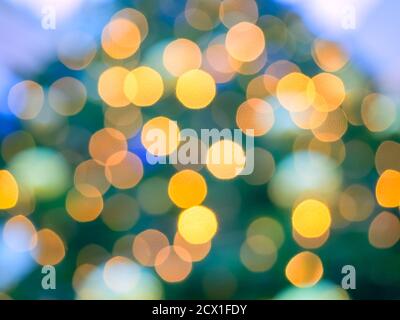 Bokeh in tonalità dorate e turchesi con sfocatura. Texture di sfondo astratta Foto Stock