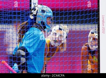 Australia's goalkeeper Toni Cronk (L) prepares with team mates Casey Eastham and Kate Jenner for a penalty corner from South Africa during their women's Group B hockey match at the London 2012 Olympic Games at the Riverbank Arena on the Olympic Park August 4, 2012. REUTERS/Dominic Ebenbichler (BRITAIN  - Tags: OLYMPICS SPORT FIELD HOCKEY)