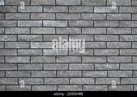 Struttura muraria in mattoni, motivo in pietra senza giunture, brickwall grigio, sfondo grigio astratto, design urbano. Casa facciata sfondo. Piastrelle decorative, carta da parati. Foto Stock